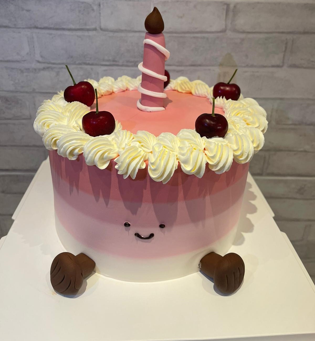 Pink ombre first birthday cake with cherries and candle, La-Luscious Bakery Grays