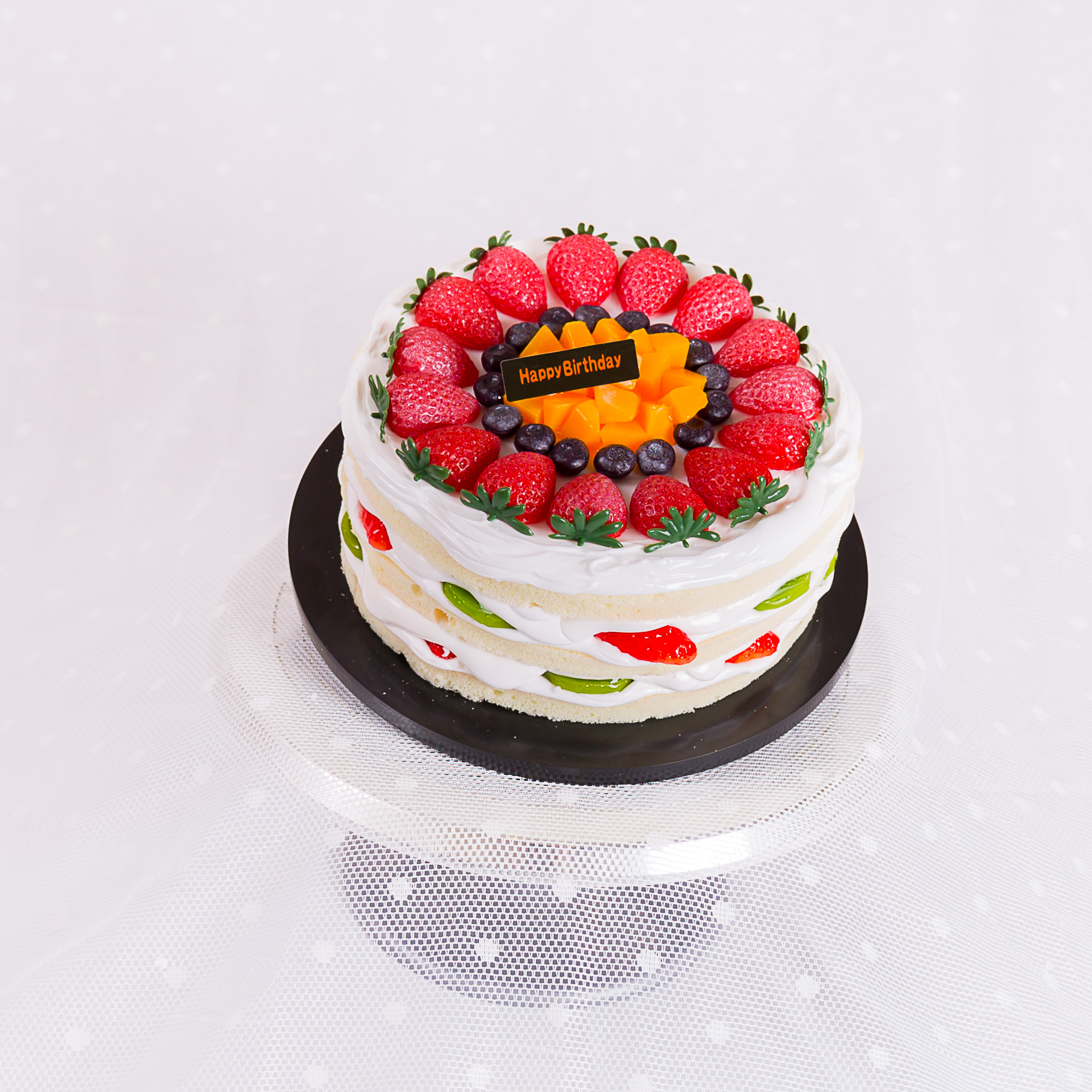 Fresh cream cake crowned with strawberries and seasonal fruit, La-Luscious Bakery Grays