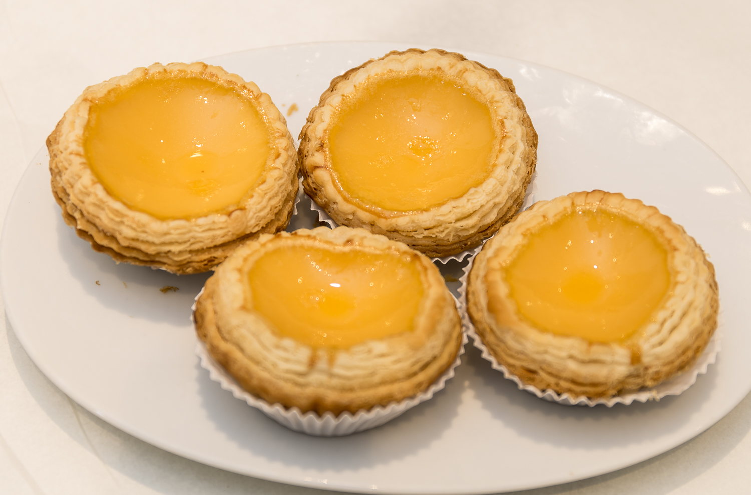 Freshly baked Chinese bakery egg tarts with flaky pastry, La-Luscious Bakery Grays