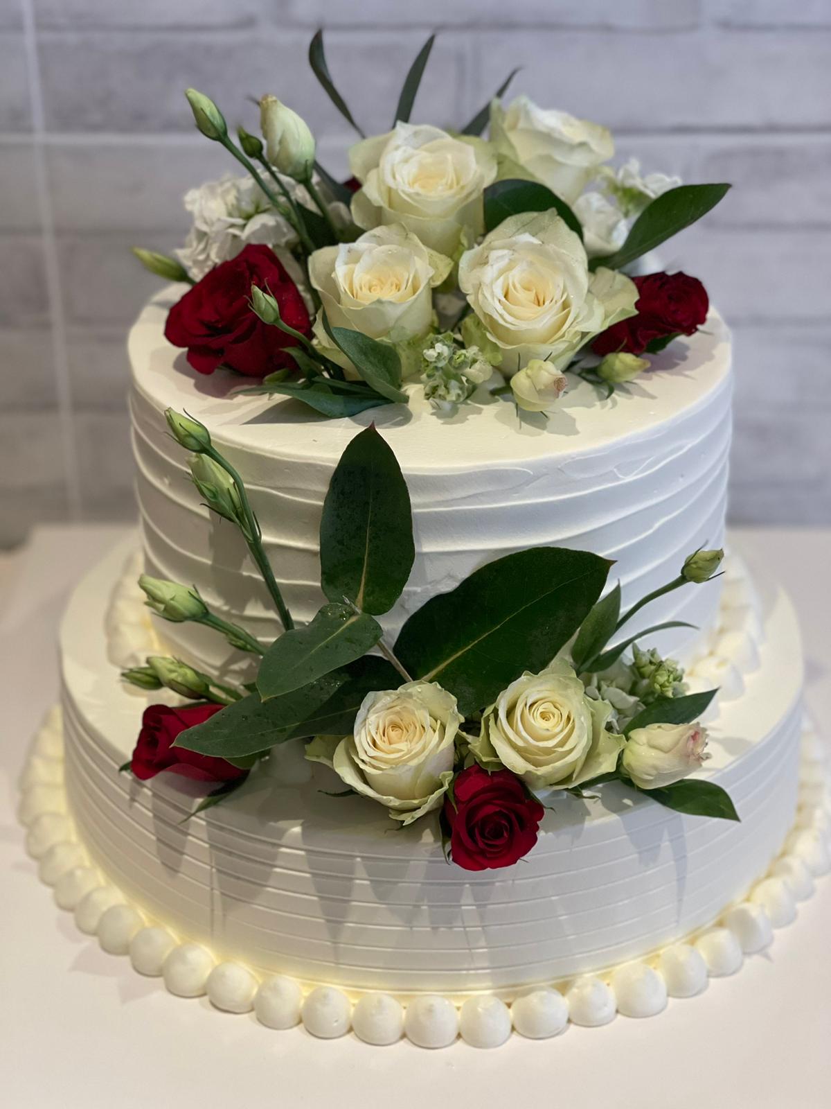 Two-tier white cake with fresh roses, eucalyptus and pearls, La-Luscious Bakery Grays