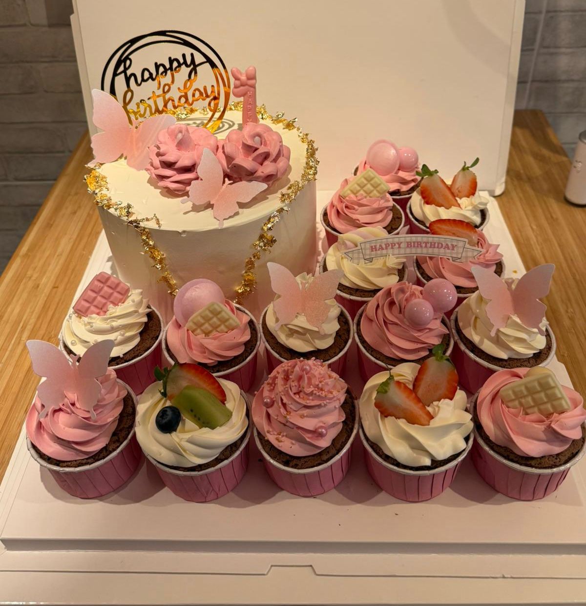 Cupcake tower with piped roses and a birthday topper, La-Luscious Bakery Grays