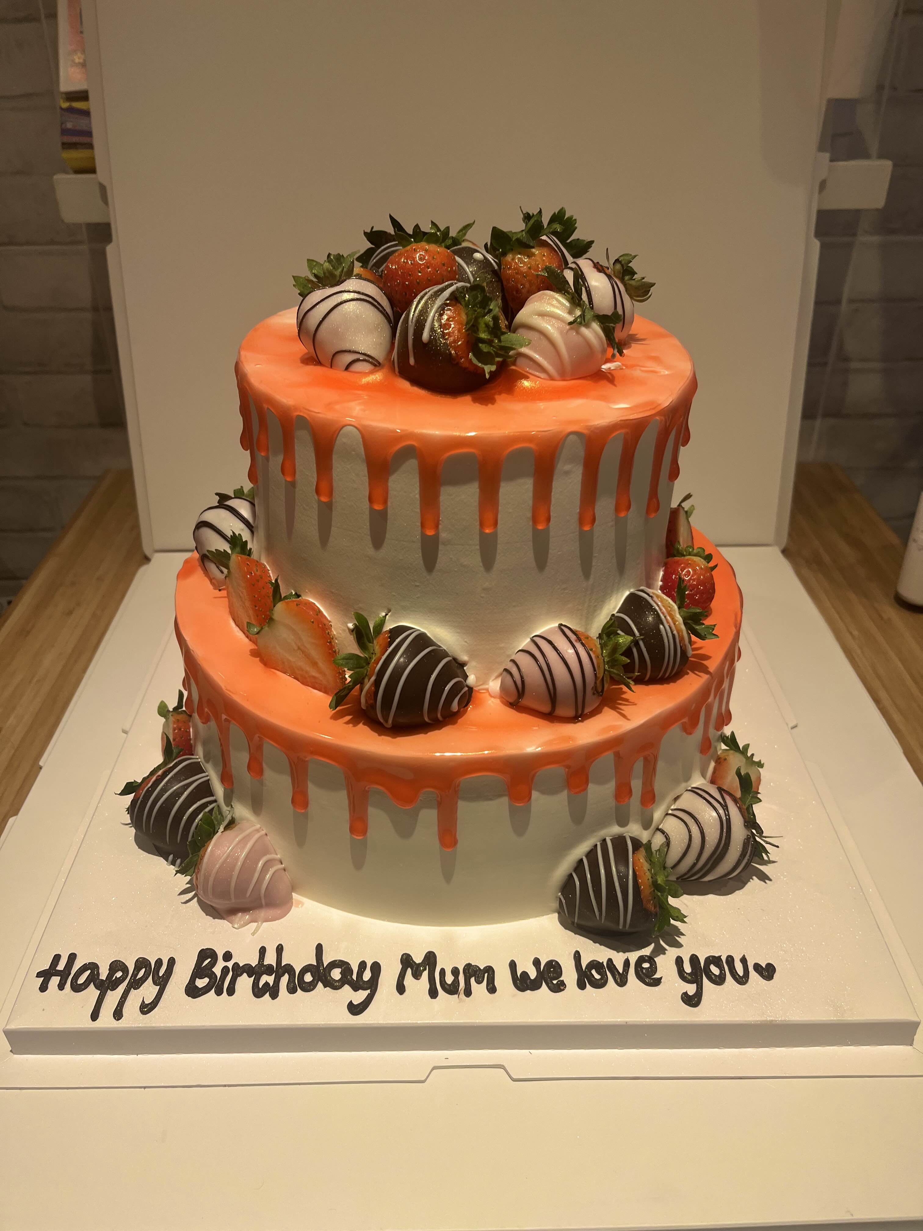Orange drip cake stacked with chocolate dipped strawberries, La-Luscious Bakery Grays