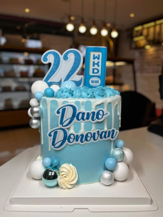Blue and white 22nd birthday drip cake with personalised name plaque
