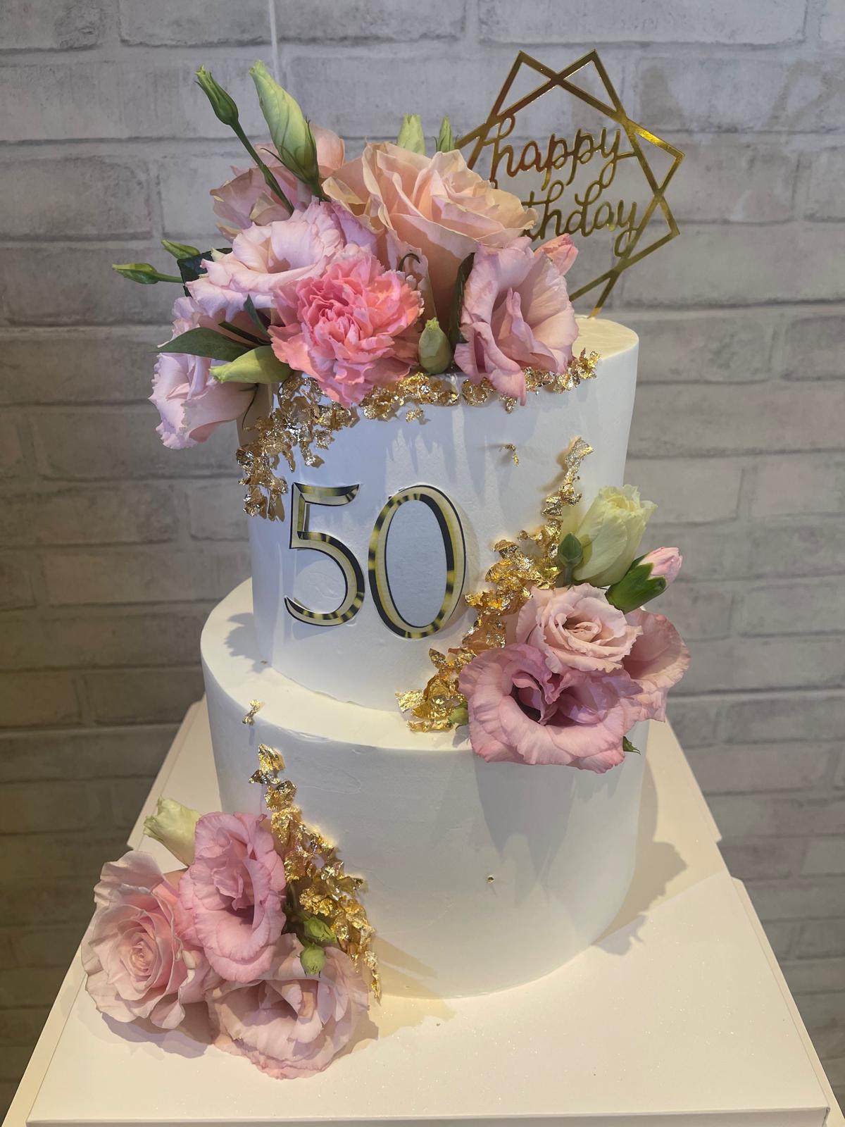 Two-tier 50th cake with pastel fresh flowers and gold frame, La-Luscious Bakery Grays